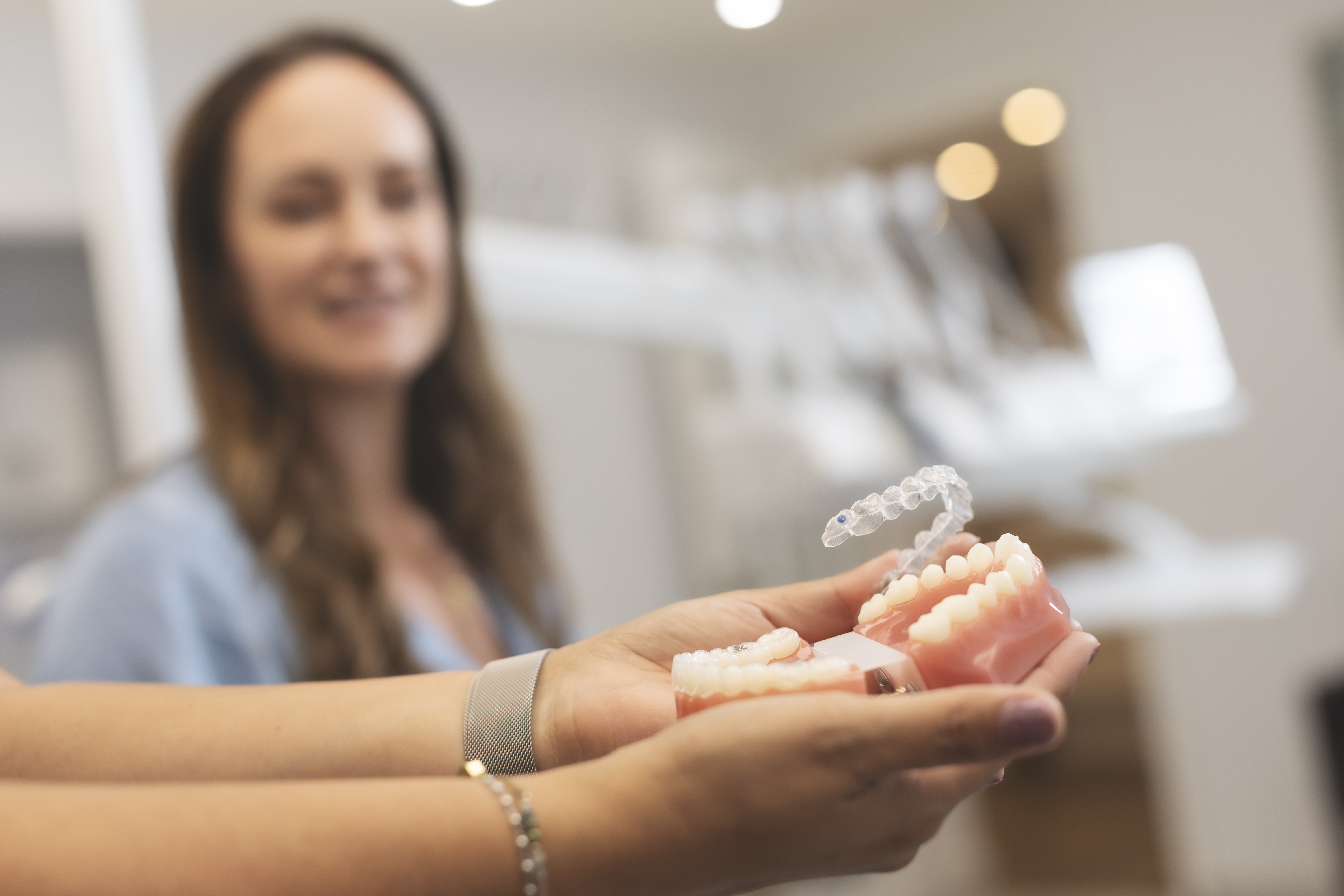 Invisalign clear aligner demonstrated on a dental model